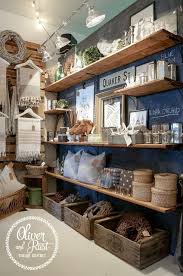 A Traves De Casa Reinal Shelving Pallets For Hanging Items Oliver And Rust The Back Of The Store Showroom Decor Store Interiors Gift Shop Displays