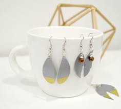 Using an easy press mini (on the lowest temperature setting) or an easy press (set to about 275 degrees), press the vinyl layers one at a time onto the baseball faux leather earring shapes. Diy Faux Leather Earrings Amy Latta Creations