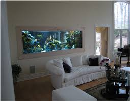 Living room design with a large fish aquarium, interior decorating. Home Aquarium Design Ideas Fish Tank Wall Wall Aquarium House Interior
