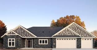 Design elements of the craftsman house if traced far enough, the roots of arts and crafts homes began with hindi bangalas, thatched roof cottages with porches and low, heavily overhung roofs. Craftsman House Modern Rustic Country Home Exterior Veneer Stone Facade Buechel Stone