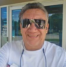 Ivan Pudge Rodriguez poses with a statue of himself outside the new Globe  Life Field, March 4, 2020. Photo by Tom Fox