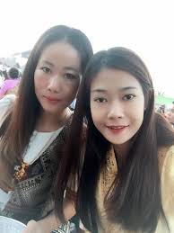 Tanh Magill is feeling happy with Jo Phouvanh Pmsl at  ງານບຸນນະມັດສະການພຣະທາດຫວຼງວຽງຈັນ.