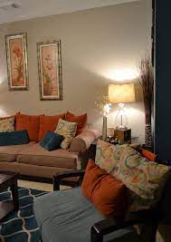 Jilsoniainteriors.com living room with purple furniture and teal shag rug. Accent Wall Rugs Coffee Table Pillows Teal Orange Living Room Living Room Orange Teal And Orange Living Room Decor Teal And Orange Living Room