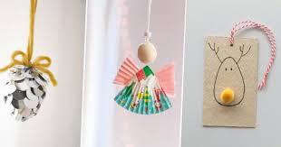 Bol cylindrique en verre, rempli de différents bonbons et décoré d'un ruban blanc. Diy Noel 10 Idees Deco De Sapin Faciles Pour Les Enfants Marie Claire