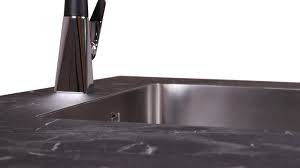 If your kitchen will have a secondary sink, allow at least 3 inches of countertop on one side and 18 inches on the other. Zero Edge
