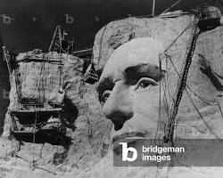 Image of Abraham Lincoln's face under construction on Mount Rushmore