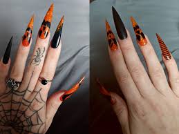 Again, black and white or orange and black colors are the best choice to create a contrast between the basic color and the halloween themed symbols. Halloween Spooky Jack O Lantern Jacko Lantern Stilettos Nails Orange And Black Orange Acrylic Nails Halloween Acrylic Nails Black Acrylic Nails