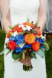 Blue and orange flowers for weddings. Orange And Blue Bridal Bouquet