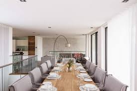 Check out housing.com news suggestions for choosing a perfect dining room colour. Modern Luxury Home Showcase Interior Dining Room With Placesettings On Dining Table Design Background Stock Photo 199375470