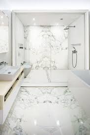 Installing large bathroom tiles helps the space feel larger than it actually is by having fewer grout lines. The Contemporary Bathroom With Stonepeak S Porcelain Floor And Wall Tiles Floornature Home Remodeling Contractors Porcelain Tile Bathroom Bathroom Interior Design