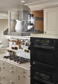 With jazzy modern flair, red and black accents wake up the style of this small kitchen. 350 Cabinet Accessories Ideas Cabinet Accessories Rev A Shelf Kitchen Storage