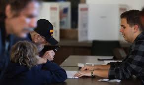 They're too young to vote, but these civic-minded high schoolers are  helping at polling sites