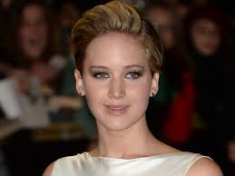 Watch: Jennifer Lawrence Walks Off The Hunger Games: Catching Fire Premiere  Red Carpet to Comfort Crying Fan