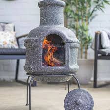 The most common fire pit chimney material is metal. Clay Stone Effect Chiminea With Stand And Lid By Air Armor Notonthehighstreet Com