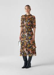 A skirt with small polka dots, a floral printed scarf and a solid color tee is a great example of subtle pattern mixing. Multicolour Clover Floral Silk Mix Skirt Whistles Whistles