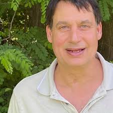 Volunteer cleans up trashed playground area