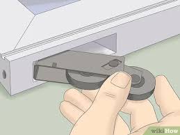 First, you have to remove the sliding panel and the stationary panel. 3 Ways To Replace Sliding Glass Door Rollers Wikihow