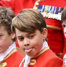 Prince George, 9, pokes tongue out as he performs special role holding  grandfather King Charles' robe at coronation