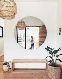 Simple Entryway Ikea Rattan Pendant Oversized Round Mirror Minimalist Wood Bench Plants White Wall Leather Living Room Furniture Living Room Leather Decor