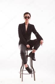 Beautiful Young Model Posing Sitting On A Chair In A High End Fashion Photoshoot Affiliate Model Posing Be Model Poses Fashion Photoshoot Young Models