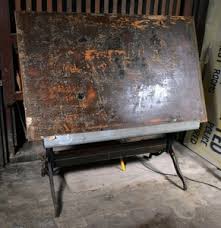 Large iron and wood dining table, adjustable as architectural desk. Lot Art Vintage Cast Iron And Wood Industrial Drafting Table