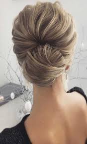 Volume braids, messy single strands, and soft white flowers unite into gorgeous and unique hairdos for brides. The Most Romantic Bridal Updos Wedding Hairstyles