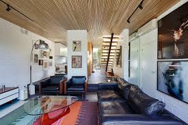 A handy guide with the differences between interior design styles including modern, industrial and transitional. Townhouse Is A Taste Of The 70s With A Mid Century Modern Twist