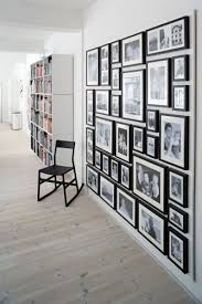 Black And White Family Photo Gallery Wall Black And White Photograph Display Black Frames White Mattes Fill A Blank Wall With Family Photos To Display The Photo Wall Display Gallery Wall Frames On Wall