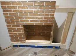 Fireplaces are one of the coziest places in a home. How To Build A Faux Diy Corner Fireplace With German Schmear Brick Treatment Frugal Family Times