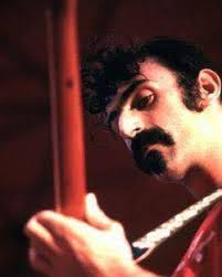 In 1966, the original confrontational TV host (who had a wooden leg) named  Joe Pyne interviewed Frank Zappa. Right off the bat in his usual  aggressive, insulting way, Pyne asks: “So, Frank,