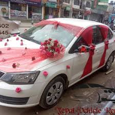 Flowers decoration with bride and groom's first letters of the name with love sign on wedding car in kathmandu nepal. Wedding Car Hire Car Decoration Kathmandu