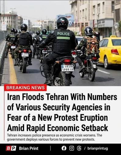 This powerful image shows a protester sitting in the middle of a street in Tehran and refusing to move as motorbike-riding security forces moved in on demonstrators. A new wave of protests
