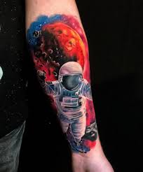Colorful space tattoo ideas for full sleeve. Arm Astronaut Space Tattoo By Endorfine Studio