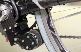 Add On Tiny Electric Bike Motor Attaches To Frame Gearjunkie Electric Bike Electric Bike Motor Electronic Bike