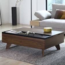 Made of sturdy wood with a black finish; Source Modern Multifunction Lift Top Wood Coffee Table On M Alibaba Com Coffee Table Furniture Coffee Table With Storage