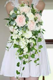 It's really up to you. Lots Of Foliage Trailing Ivy Cascading Wedding Bouquets Ivory Wedding Flowers White Rose Wedding Bouquet