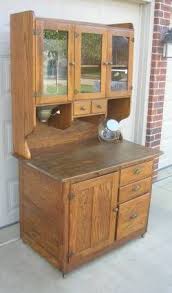 early oak hoosier style bakers cabinet