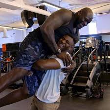 He and his siblings would wear their extended family members' clothing. Watch Ufc Star Francis Ngannou Manhandle Nba Legend Shaquille O Neal With Ease