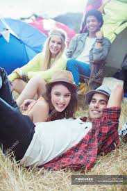 New users enjoy 60% off. Portrait Of Friends Hanging Out Outside Of Tents At Music Festival Heterosexual Couple Sitting Stock Photo 199733744