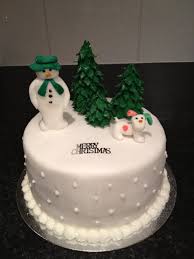 Learn to create this cute snowman cake design, perfect for winter or christmas parties! The Snowman And Snowdog Christmas Cake Christmas Trees Christmas Cake Topper Christmas Cake Decorations Christmas Cake