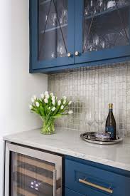 Kitchens with white cabinetry have a lot of flexibility. How To Style The Glass Cabinet Doors In Your Kitchen Designed
