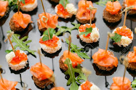 Plates with assorted snacks on an event party. Buffet At The Gala Dinner Assortment Of Canapes Banquet Service Catering Food Snacks With Salmon And Caviar Rye Wheat Bread Stock Photo Picture And Royalty Free Image Image 124526912