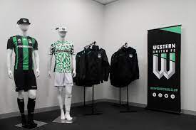 The top of the shoulders and the sleeves are coloured black whilst the collar and cuffs are coloured green. Pop Up Store Get Your Western United Shirt And Merch Now Western United