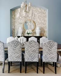 Small living room with 2 zebra print armless chairs, one small white sofa, glass coffee table and black floor rug on wood flooring. Project Reveal An Elegant Dining Room With A Fresh New Look Designed