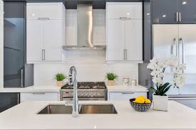 The glossy white subway backsplash tiles develop a classic edge. Why Quartz Is A Great Alternative To Marble And Granite