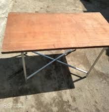 Setelah itu, rekatkan 3 potong kayu menggunakan lem dan penjepit. Meja Lipat Untuk Jualan Event Promosi Upacara Dan Kegiatan Lainnya