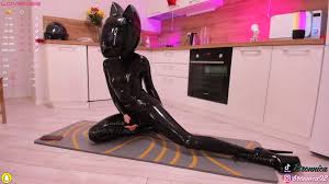 Latex catsuit and motorcycle helmet