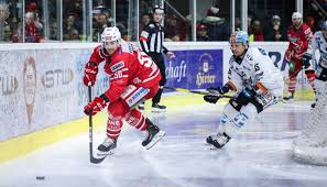 Ice hockey is a contact team sport played on ice, usually in an indoor or outdoor rink, in which two teams of skaters use their sticks to shoot a vulcanized rubber puck into their opponent's net to score goals. Eishockey Liga Prasentiert Neuen Titelsponsor Sky Sport Austria