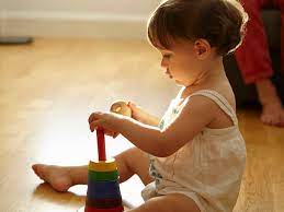 How does a baby rattle help with cognitive development? Cognitive Developmental Milestones