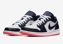 It appears to feature a white leather base with obsidian and university blue overlays and travis' signature reverse swoosh on the lateral in white. Jordan 1 Low Obsidian 553558 481 First Look Info Sneakernews Com